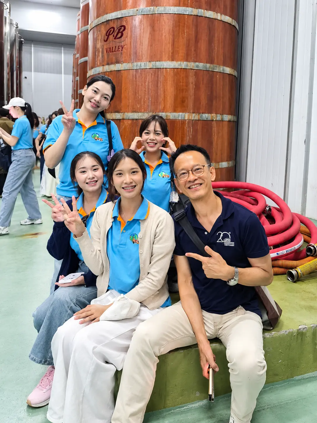 Smiling Factory Tour Group Selfie KBU Aviation